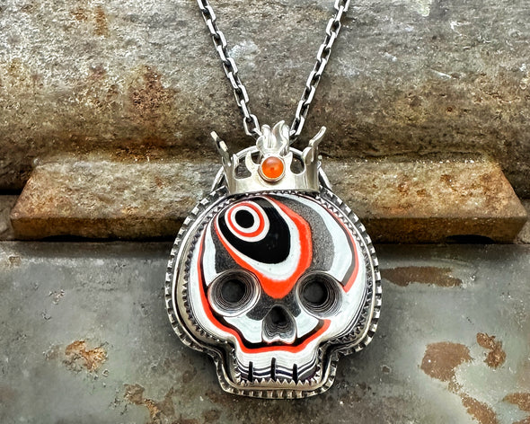 Fordite Skull with Carnelian