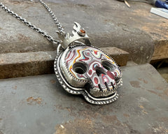 Fordite Skull with Citrine